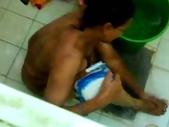 bathing aunty caught in cam